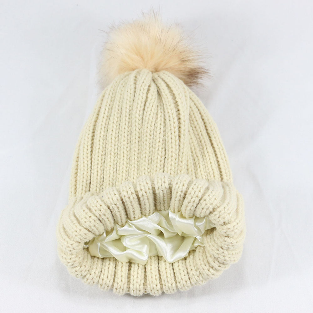 European and American Winter Hot-Selling Pom-Pom Knitted Hat Thickened High Elastic Satin Lined Knit Hat Versatile Windproof Warm