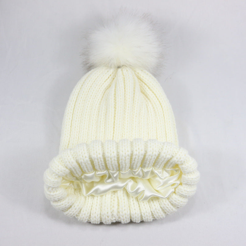 European and American Winter Hot-Selling Pom-Pom Knitted Hat Thickened High Elastic Satin Lined Knit Hat Versatile Windproof Warm