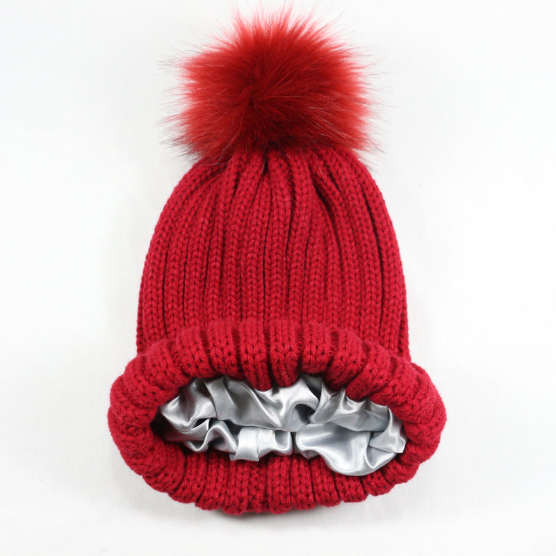 European and American Winter Hot-Selling Pom-Pom Knitted Hat Thickened High Elastic Satin Lined Knit Hat Versatile Windproof Warm