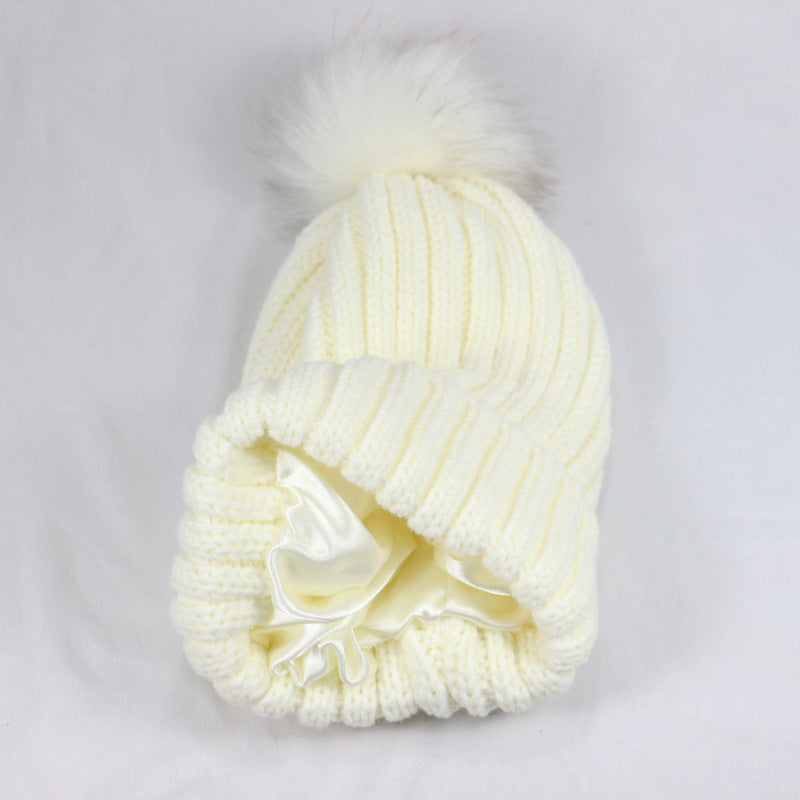 European and American Winter Hot-Selling Pom-Pom Knitted Hat Thickened High Elastic Satin Lined Knit Hat Versatile Windproof Warm