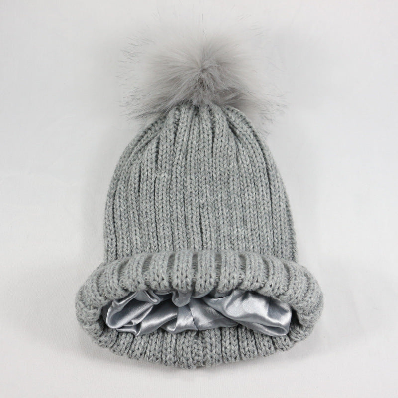 European and American Winter Hot-Selling Pom-Pom Knitted Hat Thickened High Elastic Satin Lined Knit Hat Versatile Windproof Warm 